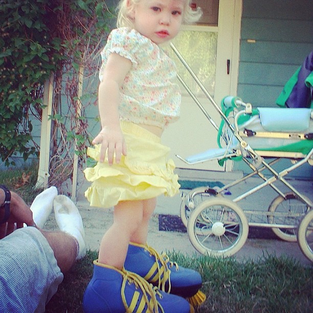 toddler girl wears moms roller-skates instagram