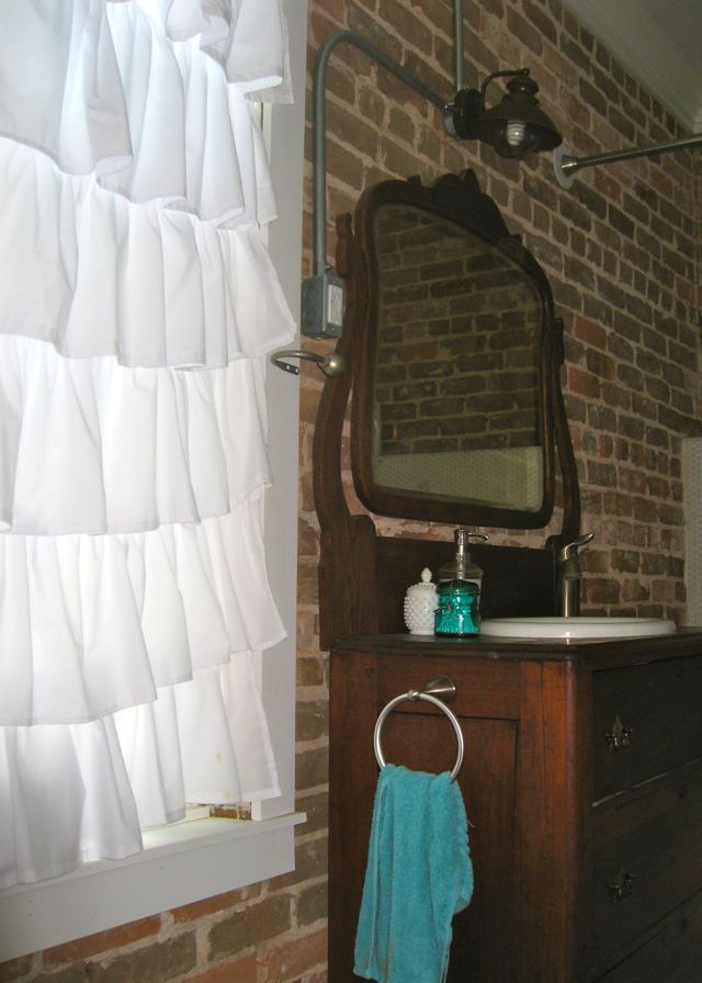 urban outfitters ruffle curtain exposed brick antique vanity dresser