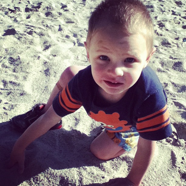 little boy playing in sand instagram