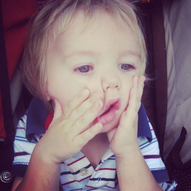 little boy squeezing cheeks making face instagram