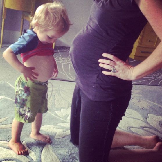 pregnant mom and little boy compare bellies instagram