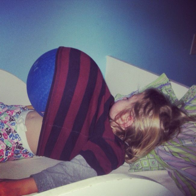 little girl sleeping with ball in shirt instagram