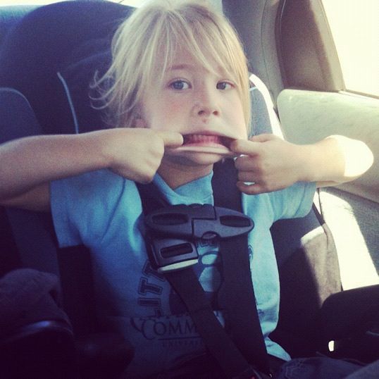 little girl car seat making face instagram