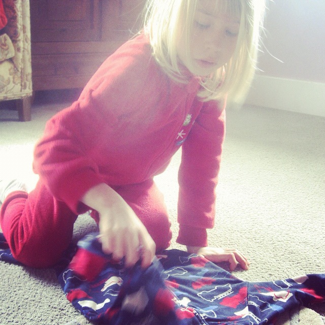 little girl folding laundry instagram